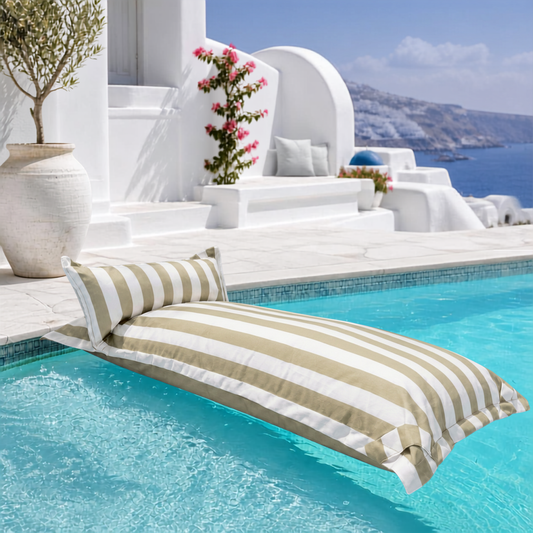 White and khaki striped Big Bertha Premium Single floating beanbag lounger cover in a swimming pool, 70 x 180 cm.