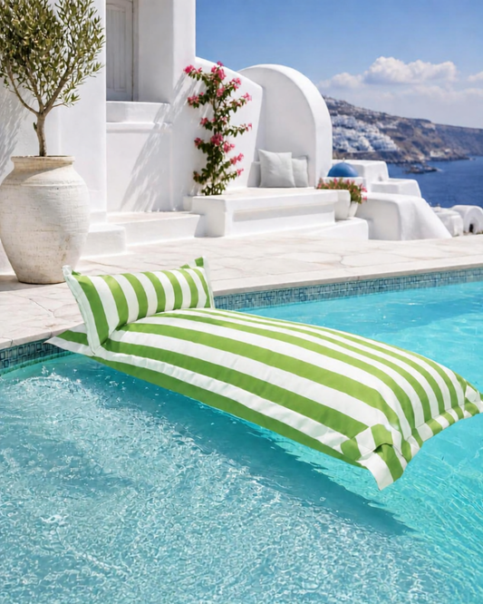 White and light green striped Big Bertha Premium Single floating beanbag lounger cover in a swimming pool, 70 x 180 cm.