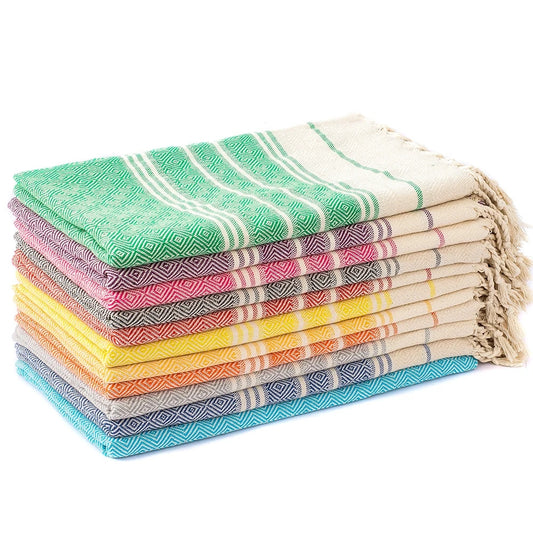 Stack of Turkish tassel towels folded together, showing pattern, weave and tassels.