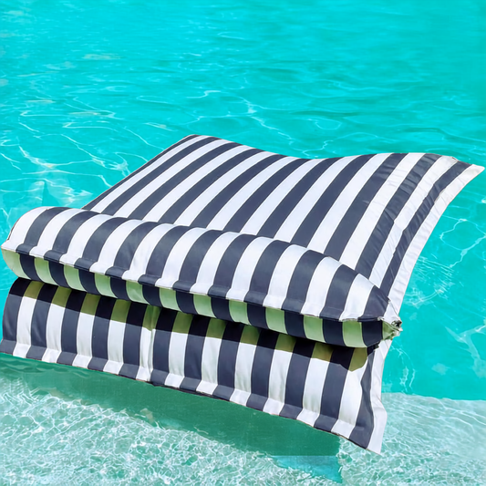 White and dark grey striped Big Bertha Premium Double floating beanbag lounger cover in a swimming pool, 140 x 180 cm.