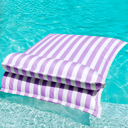 White and purple striped Big Bertha Premium Double floating beanbag lounger cover in a swimming pool, 140 x 180 cm.