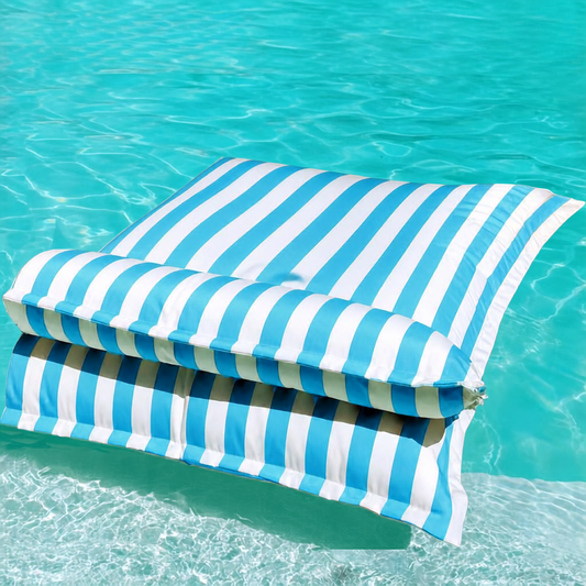 White and sky blue striped Big Bertha Premium Double floating beanbag lounger cover in a swimming pool, 140 x 180 cm.