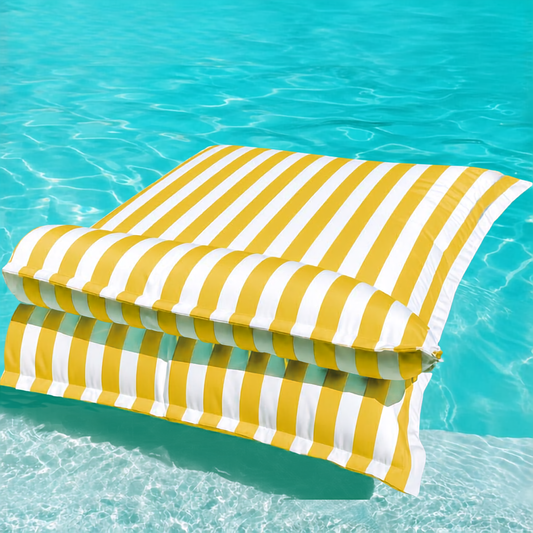 White and yellow striped Big Bertha Premium Double floating beanbag lounger cover in a swimming pool, 140 x 180 cm.