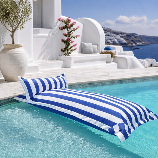 White and blue striped Big Bertha Premium Single floating beanbag lounger cover in a swimming pool, 70 x 180 cm