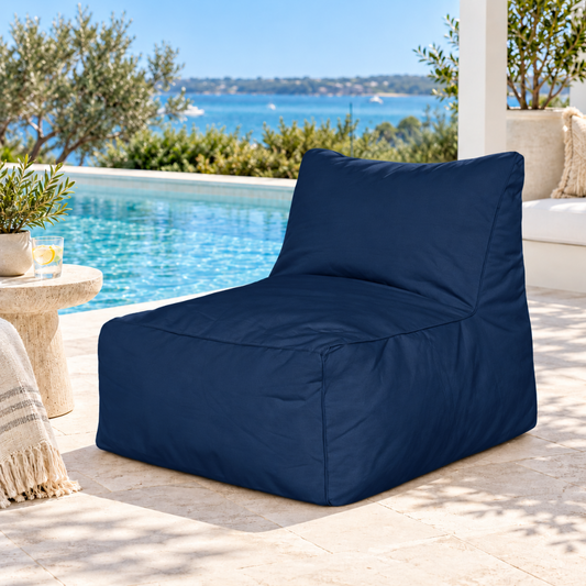 Navy Hamptons outdoor bean bag lounge chair styled in a coastal poolside setting