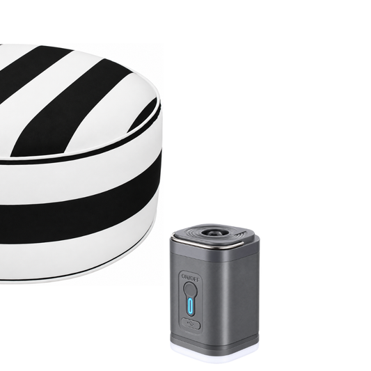 Grey USB rechargeable electric air pump beside a black and white striped outdoor inflatable ottoman.